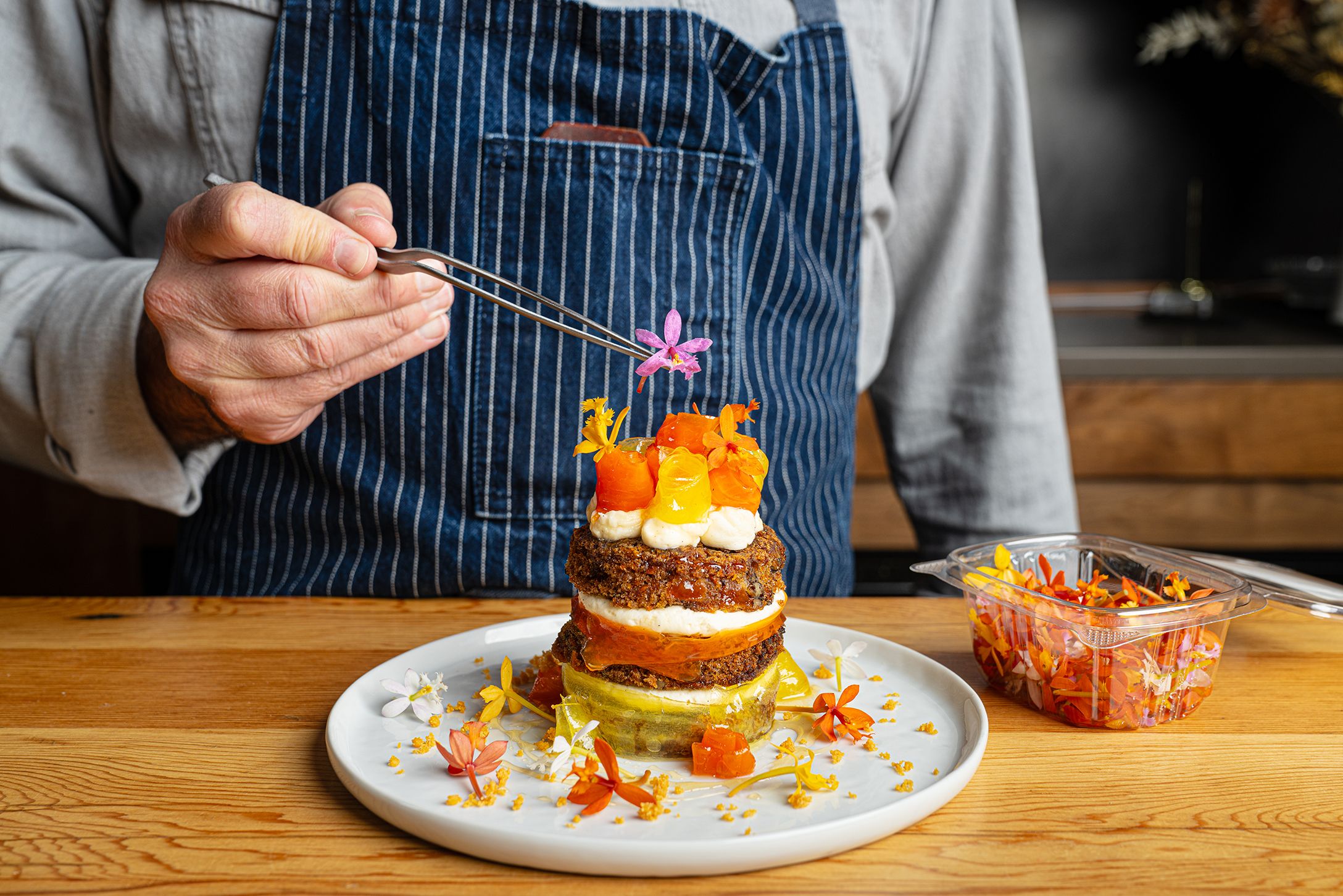 240313 Fresh Origins Brick Hall 00346 Chef plating with Fresh Origins Edible Flowers